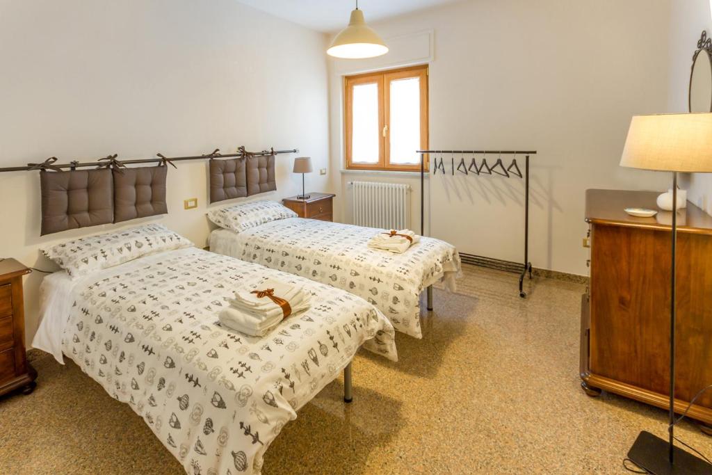 Postel nebo postele na pokoji v ubytování Buon Vento
