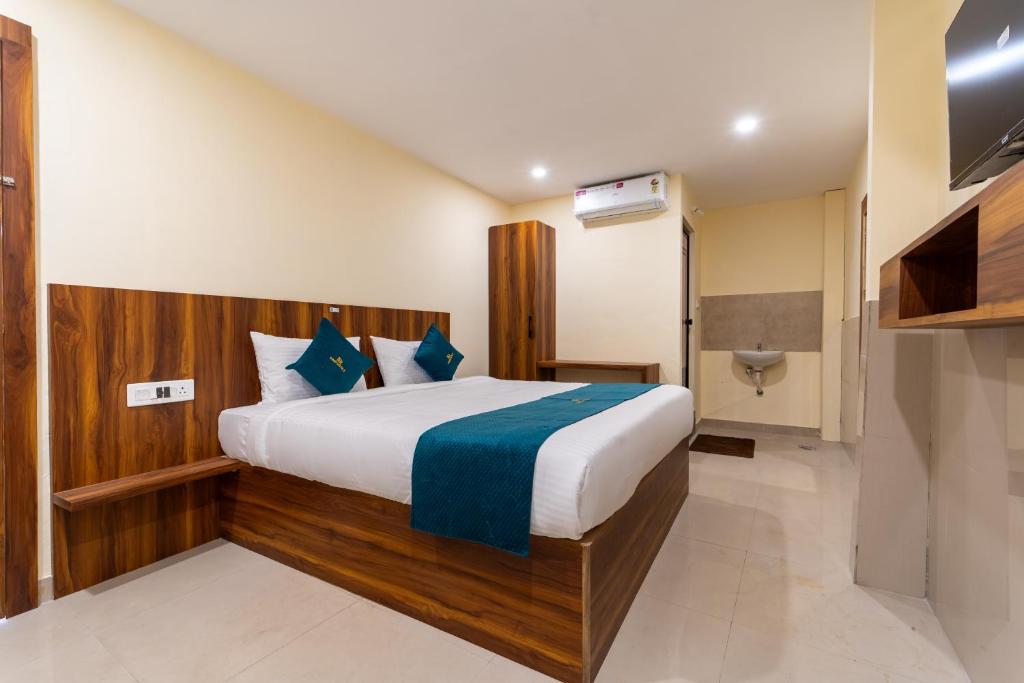 a bedroom with a bed in a room at SAAD Residency in Cochin