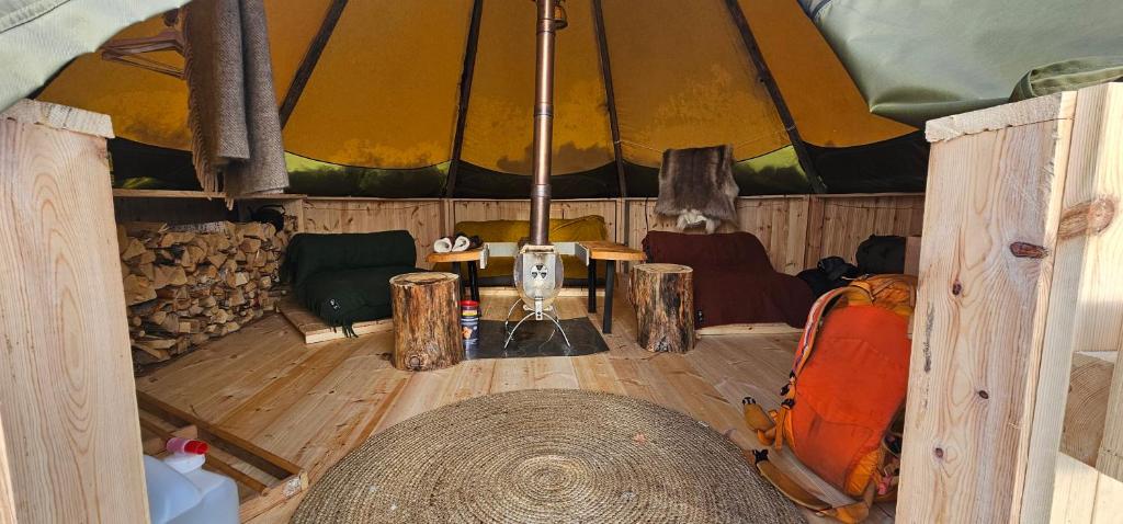 an inside view of a room with a tent at Tipi Mountain Camp in Sorsele
