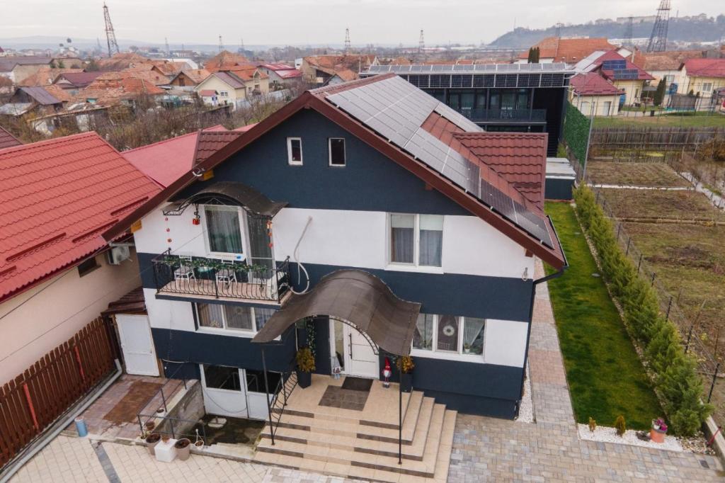 an overhead view of a house with red roof at Gold Residence in Ocna-Mureşului