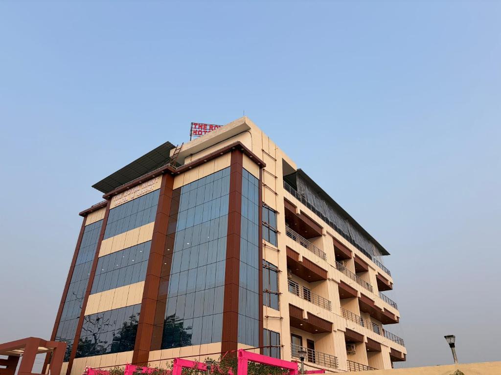 a tall building with a lot of windows at Royal Night Hotel & Resort in Gaya