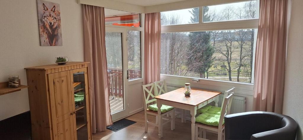 a dining room with a table and a window at Ferienresort mit Pool am Schluchsee in Schluchsee