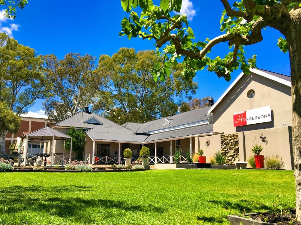 a house with a lawn in front of it at Hendersons Lodge Ltd in Senekal