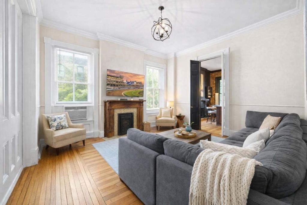 a living room with a couch and a fireplace at Charming 7BR Home Bourbon Trail & Attractions in Louisville