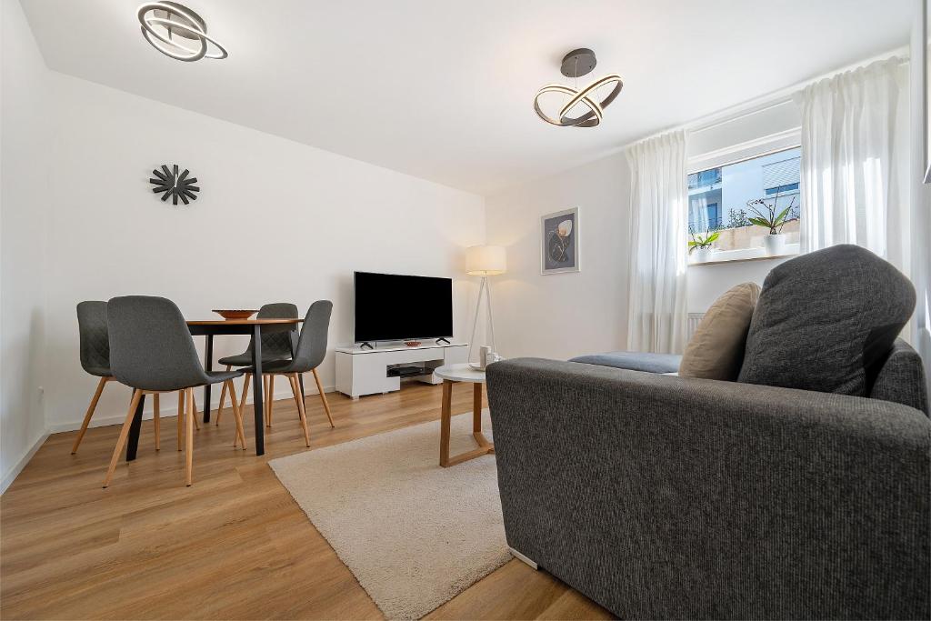 a living room with a couch and a table at Ferienwohnung Auszeit in Calw