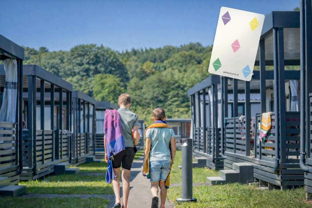 two people walking down a path at Camping Resort Riegersburg in Riegersburg