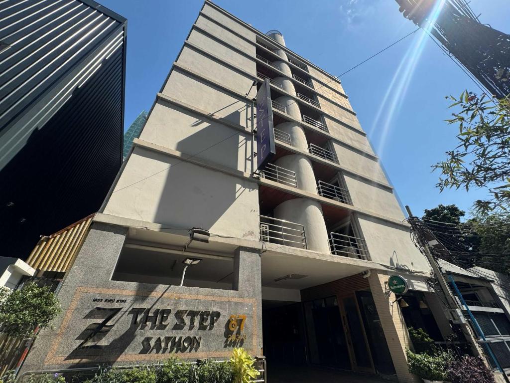 a building with a sign that reads the step union at Collection O The Step Sathorn in Bangkok