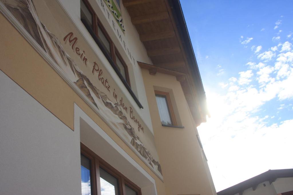 a building with a sign on the side of it at Appartement Rauch in Sölden