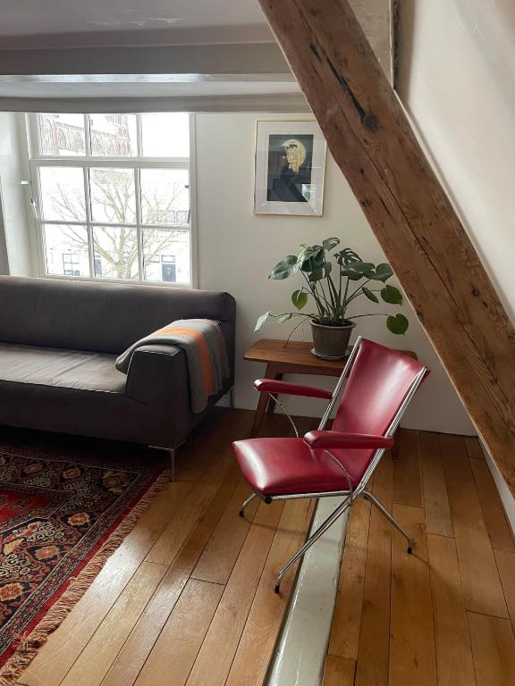 a living room with a couch and a table at Appartement city center in Harlingen
