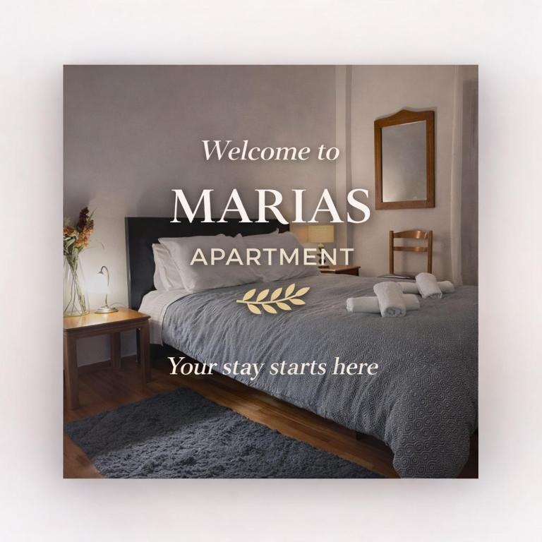 a sign that says welcome to marias apartment with a bed at MARIAS APARTMENT SMART KEY BOX by WESTBOOKING GR in Agrinio