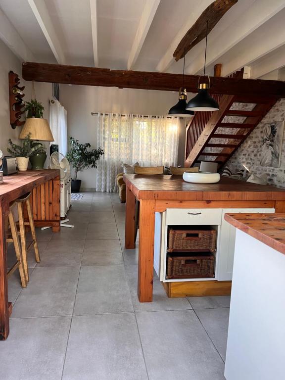 a kitchen with a counter and an oven in it at Loft on Honey in Sunridge Park