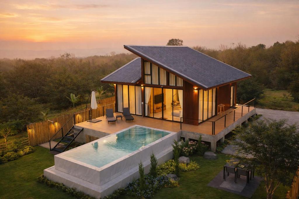 an overhead view of a house with a swimming pool at Solitude Villas in Ban Chang Talut