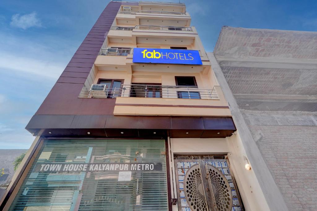 a building with a sign on top of it at FabHotel Metro Inn in Kānpur