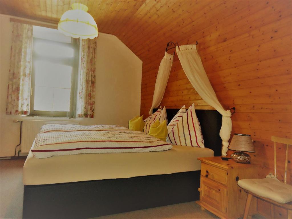 Postel nebo postele na pokoji v ubytování Haus Obernig