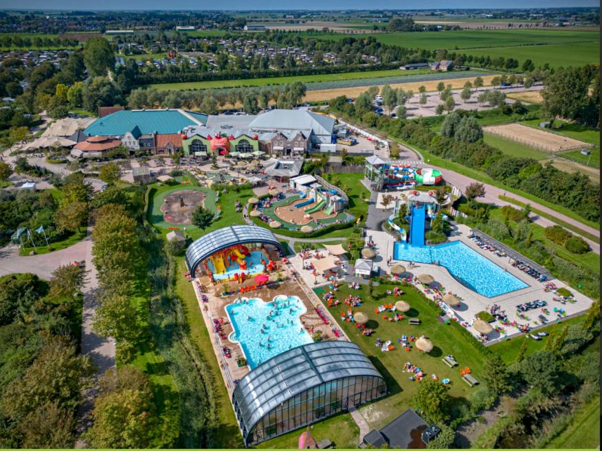 an aerial view of a water park with an amusement park at Stacaravan 161 Capfun camping Bongerd 5 sterren Gezin 5 personen in Tuitjenhorn