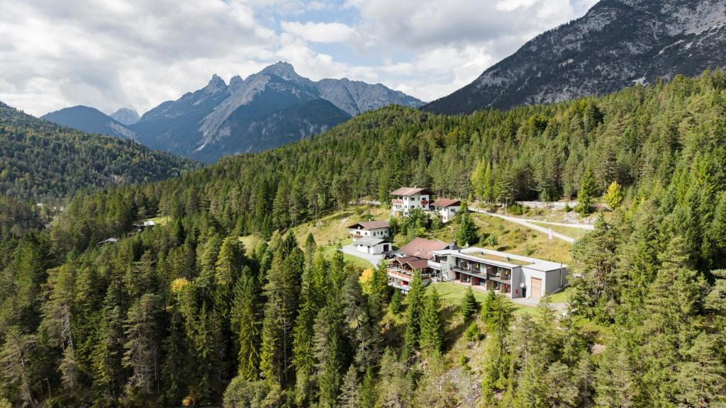an aerial view of a house in the mountains at Hotel Garni Isarlodge Wiesenhof in Scharnitz