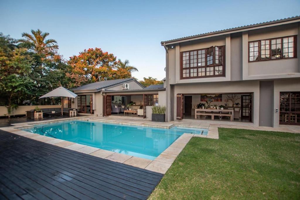 a house with a swimming pool in the yard at Panorama View Pool House Steiltes I in Nelspruit