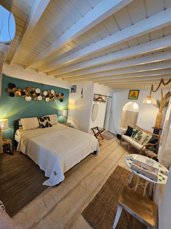 a bedroom with a large bed in a room at Capparis Studio in Mikonos