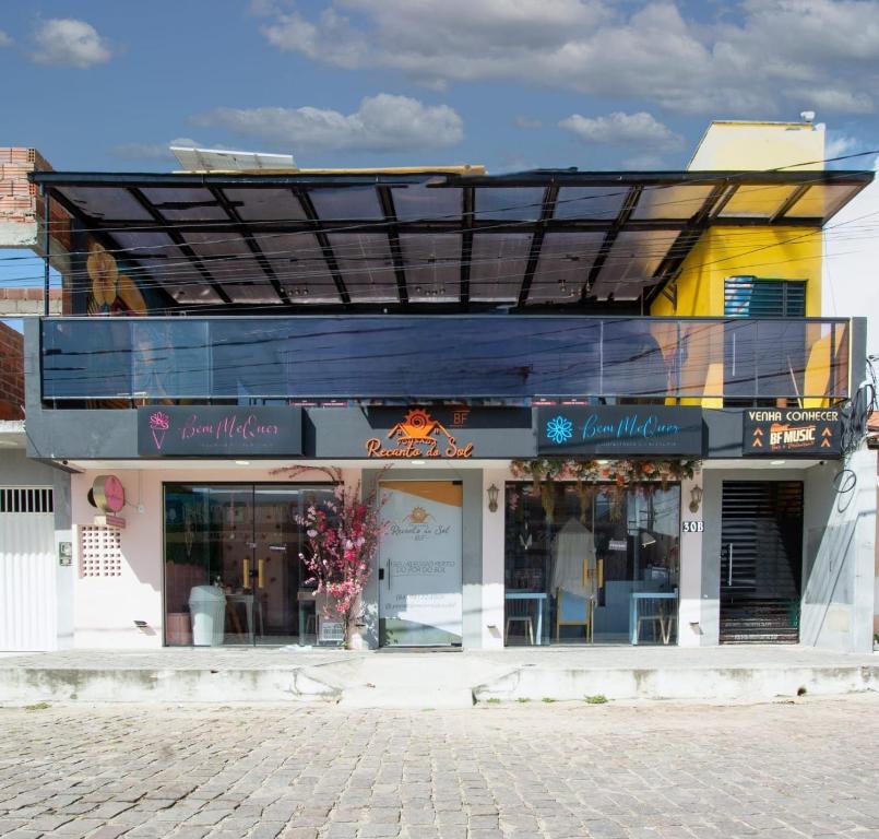 a store front of a building on a street at Pousada Recanto do Sol BF in Baía Formosa