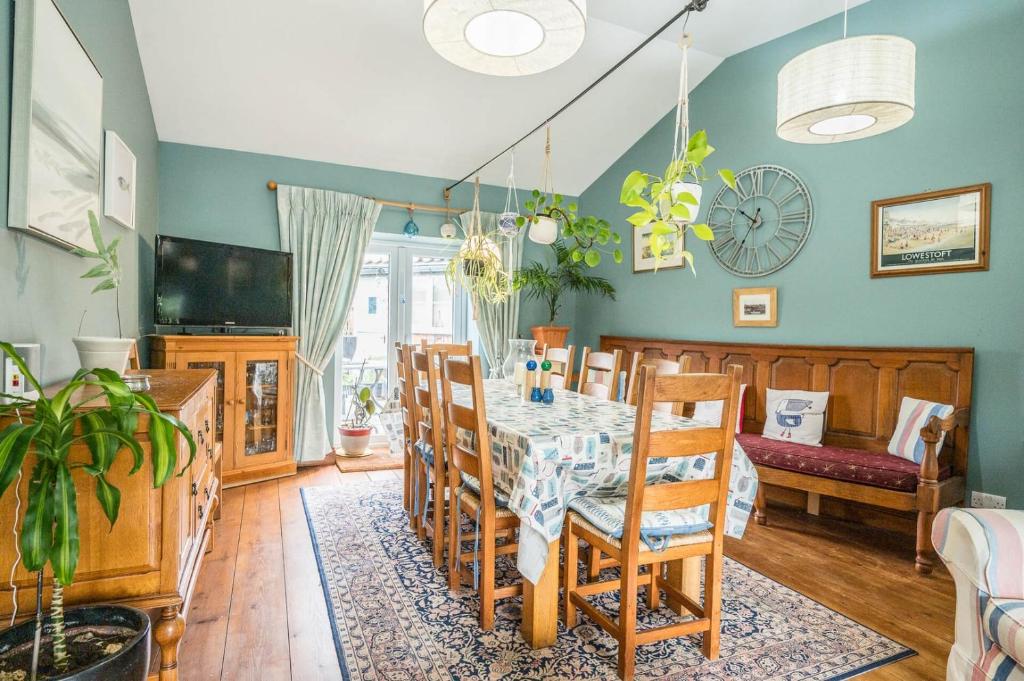 a dining room with a table and chairs at The Old Bakery, Wrentham in Wrentham