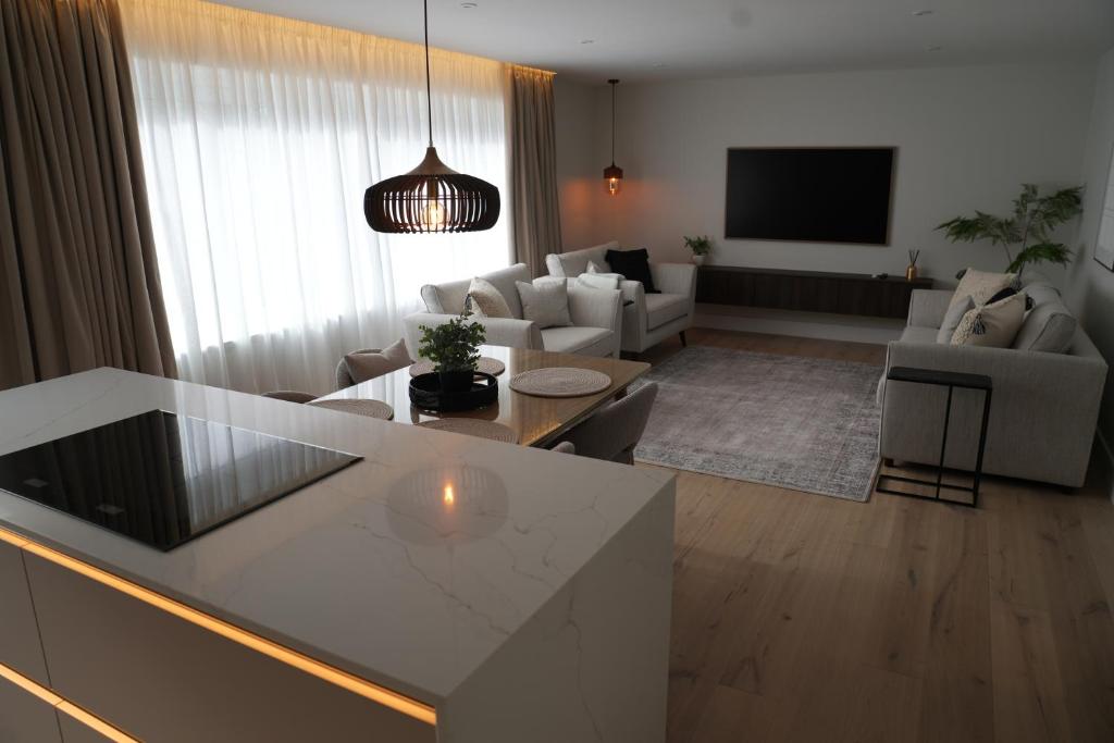 a living room with a couch and a table at 1st Floor Luxury 2-Bed Apt Sleeps 6 in St. Andrews