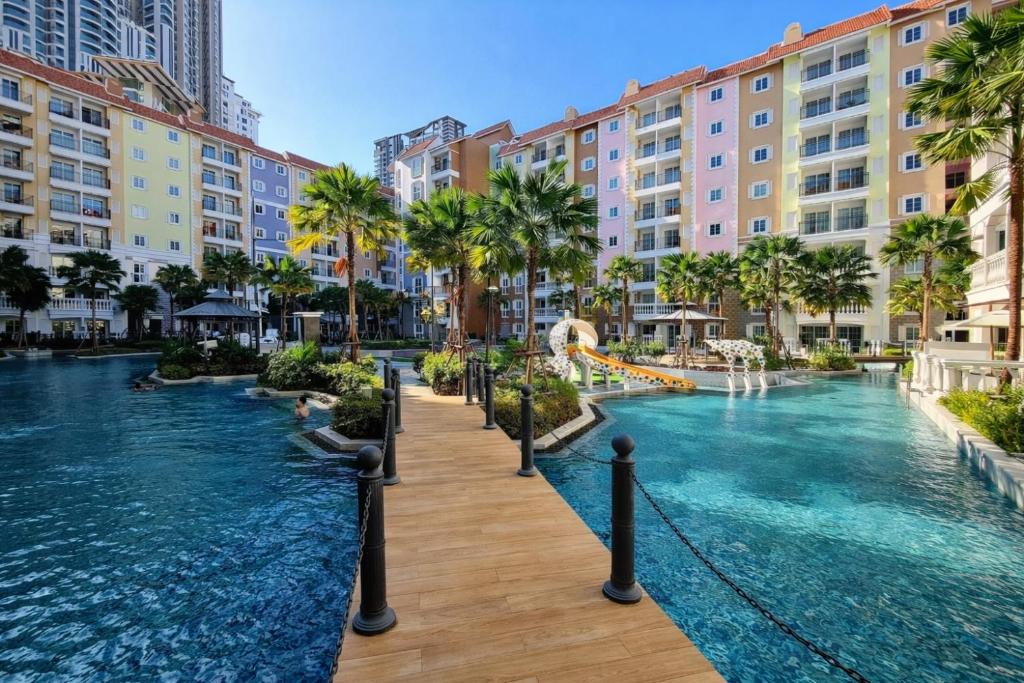 a pool at a resort with a water slide at Seven Seas Code di Azur in Na Jomtien