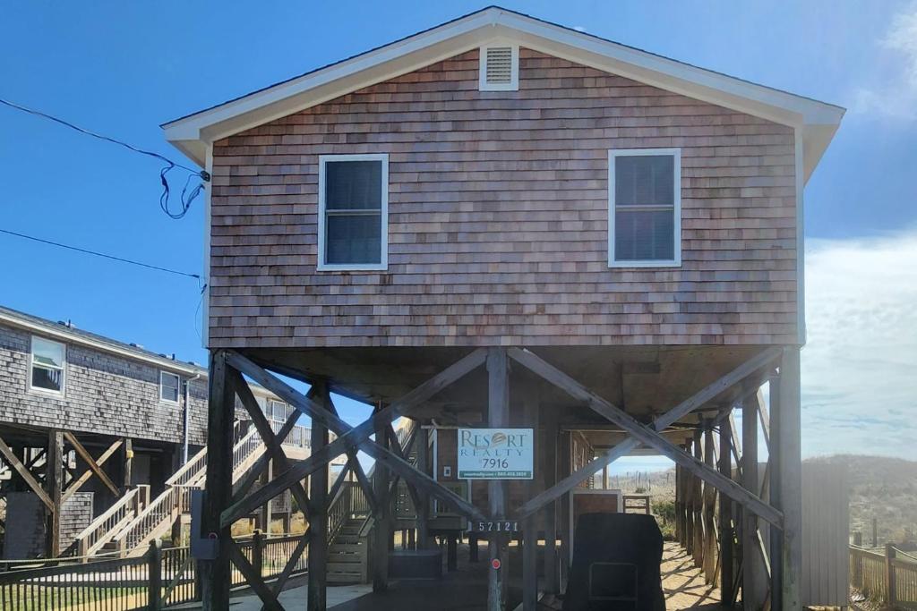 a building with a roof on top of it at 7916 - Hatteras Vista in Hatteras