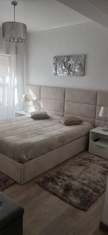 a bedroom with a large bed in a room at Casa da Gena in Nazaré