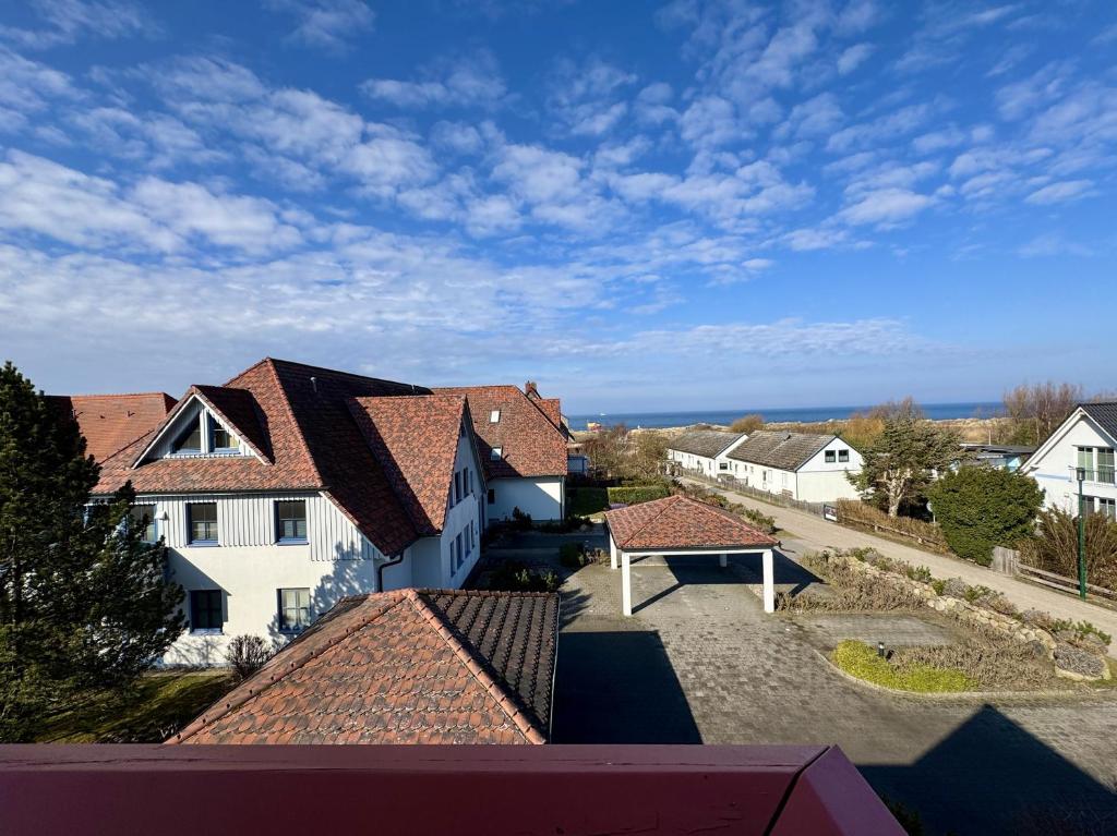 an aerial view of a house with roofs at Oewern Diek App 09 in Wustrow