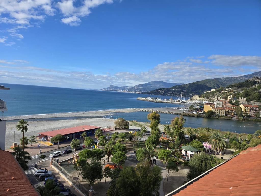 a view of a city and the ocean at Casa Giardino Vista Mare in Ventimiglia