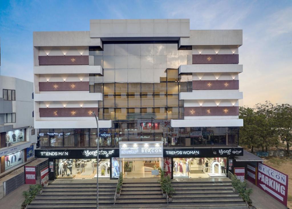 a rendering of a building with stairs in front at Rajpath Beacon Hotel Belagavi in Belgaum