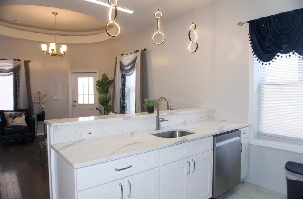 a kitchen with a sink and a counter top at Master room w private bathroom 23 in Guttenberg