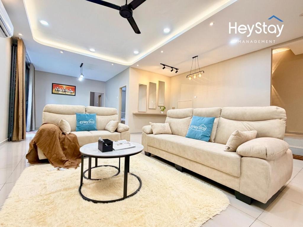 a living room with two couches and a table at MaaiVilla 22Pax4B4B PrivatePool Pooltable BBQ in Gua Sai