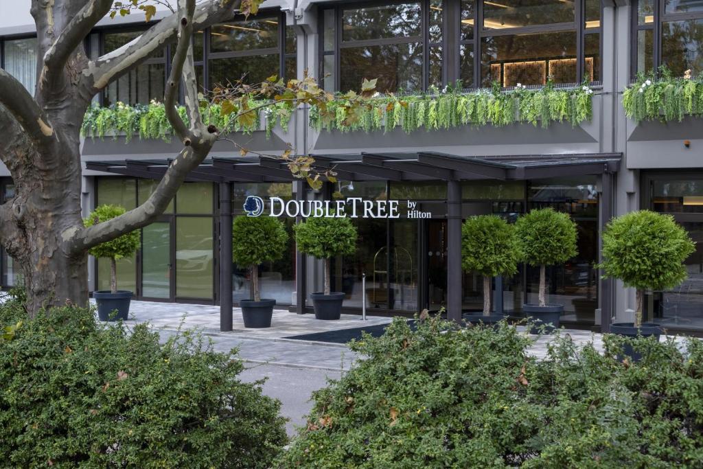a building with a sign in front of it at DoubleTree by Hilton Berlin Ku'damm in Berlin