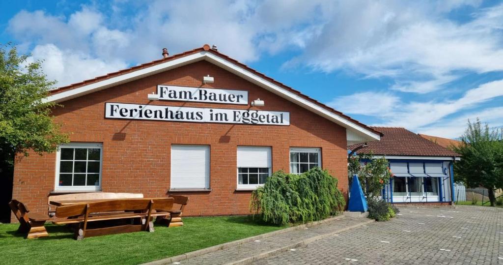 a brick building with a bench in front of it at Ferienhaus im Eggetal in Preußisch Oldendorf