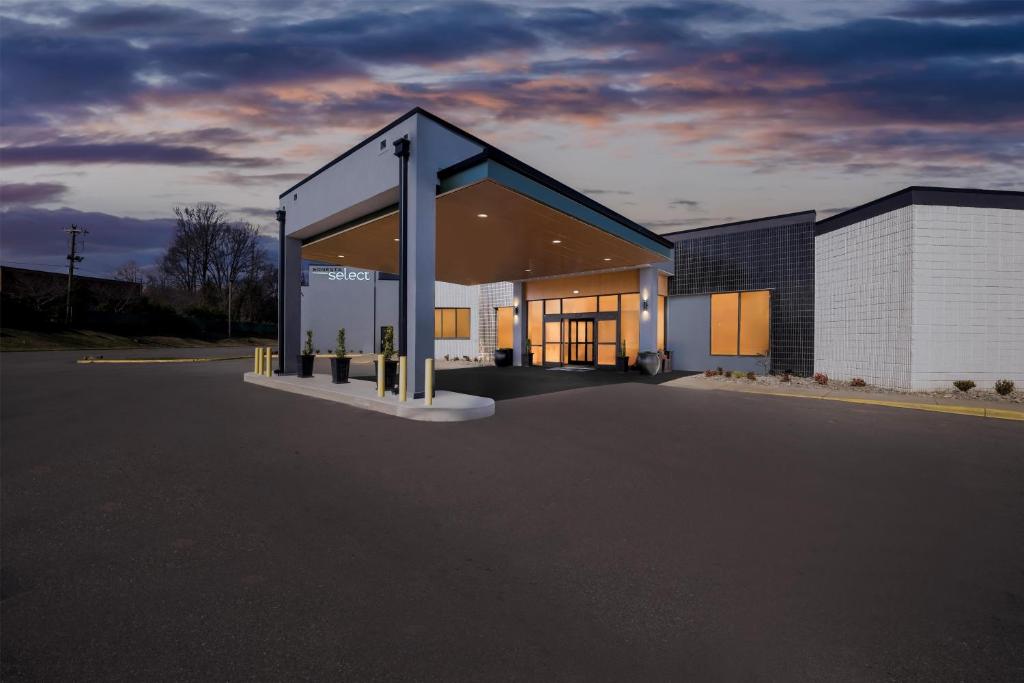 a rendering of a building with a sunset at Sonesta Select Hotels Statesville in Statesville
