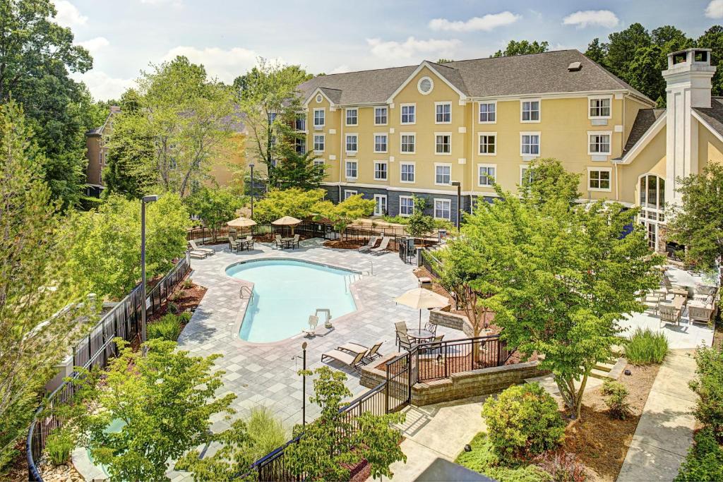 an aerial view of a hotel with a swimming pool at Homewood Suites by Hilton Raleigh/Cary in Cary
