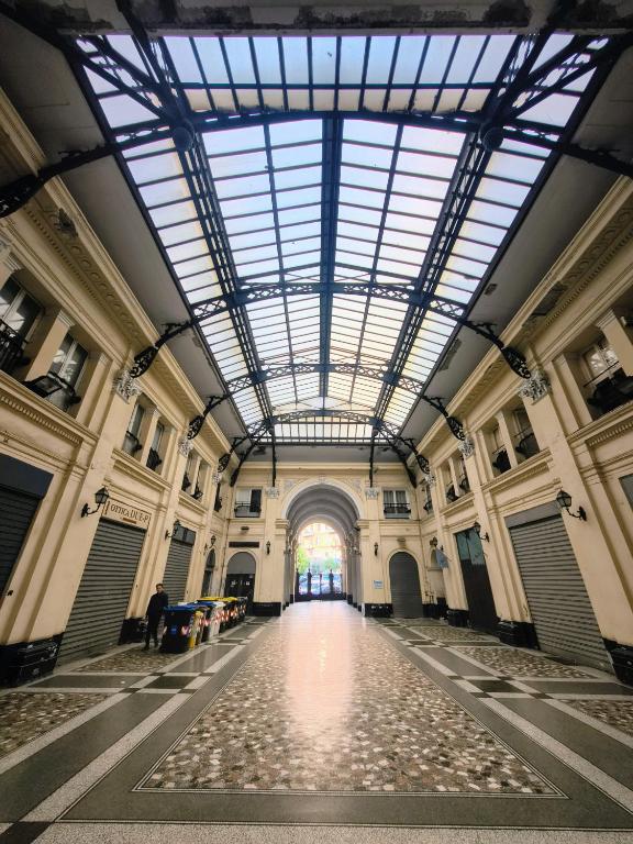 a hallway of a building with a large glass ceiling at Due Monelli in Naples