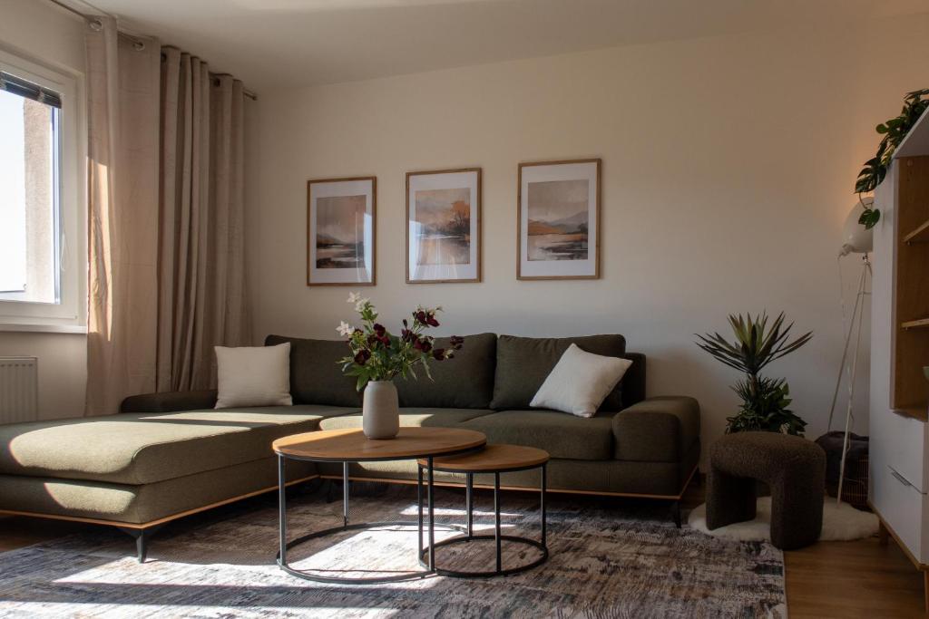 a living room with a couch and a table at The Elegant Hideaway in Šurany