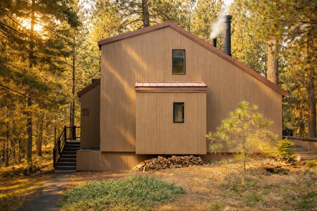 a house in the middle of a forest at Ridge Cabin 022 in Black Butte Ranch