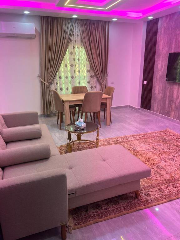 a living room with a couch and a table at Luxor lights palace in Luxor
