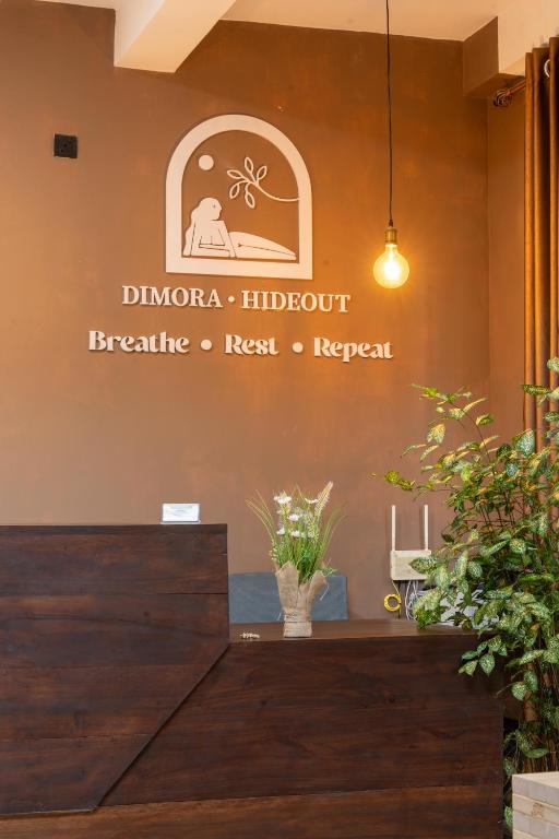 a sign on the wall of a dermatologist office at Dimora Hideout in Homagama