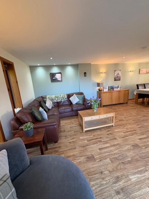 a living room with a couch and a table at Arcadia - Kirkwall in Orkney