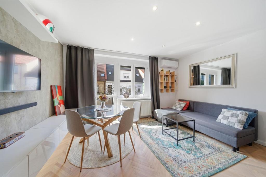 a living room with a couch and a table at Haban Haus in Bratislava