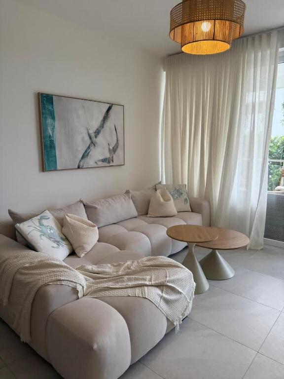 a living room with a couch and a table at Victoria's home near the beach with Swimming pool and elevator in Punta Cana