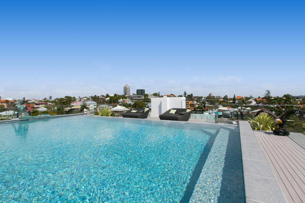 a large swimming pool on top of a building at Menso at Southbank in Brisbane