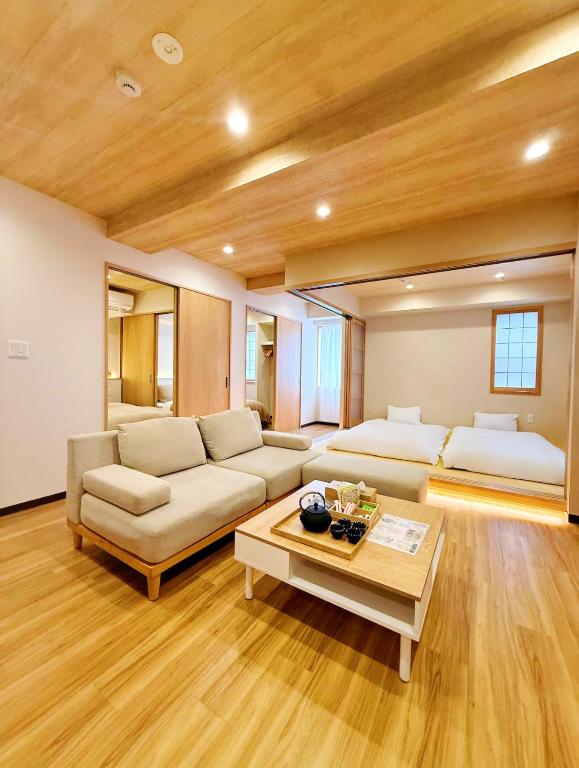 a living room with a couch and a table at Ueno K in Tokyo