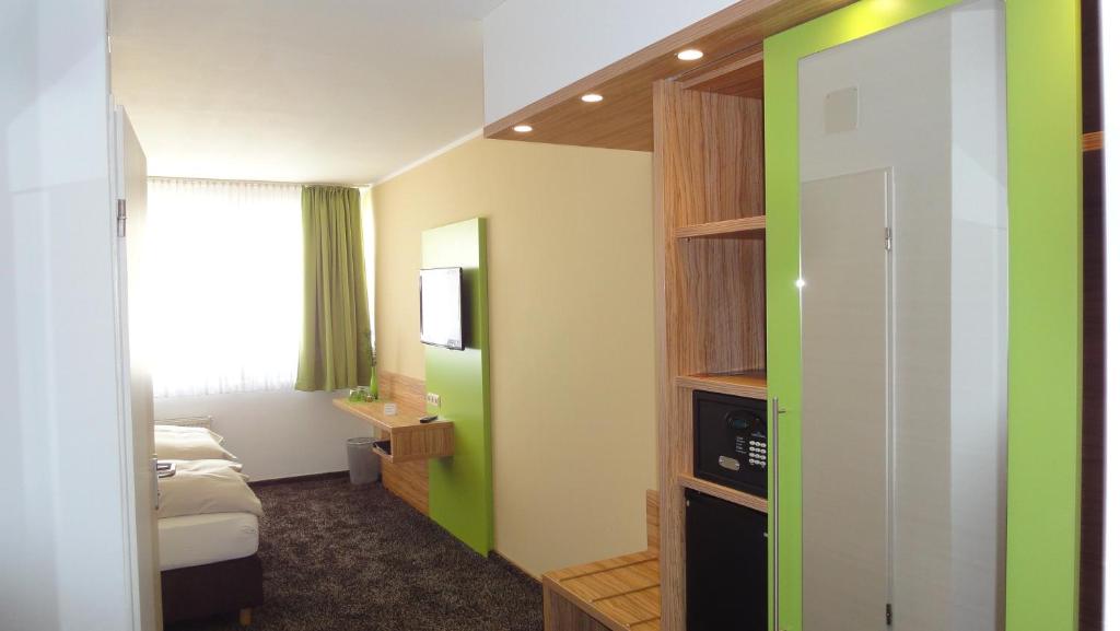 Postel nebo postele na pokoji v ubytování Hotel Scheidberg