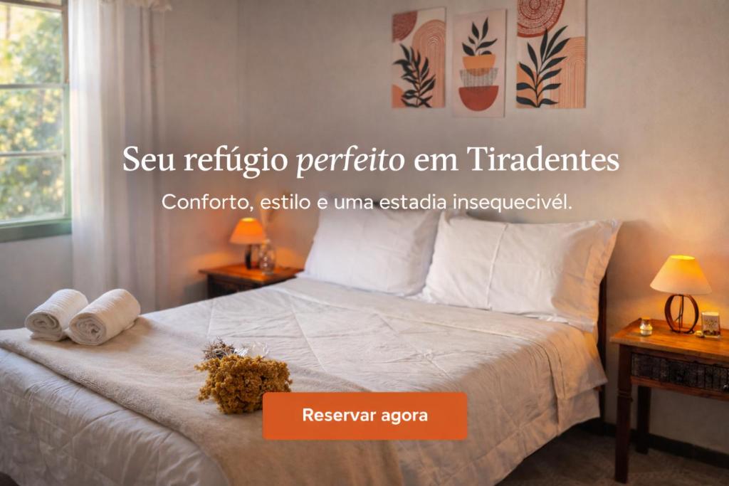 a bedroom with a bed with two towels on it at Refúgio da Guta in Tiradentes