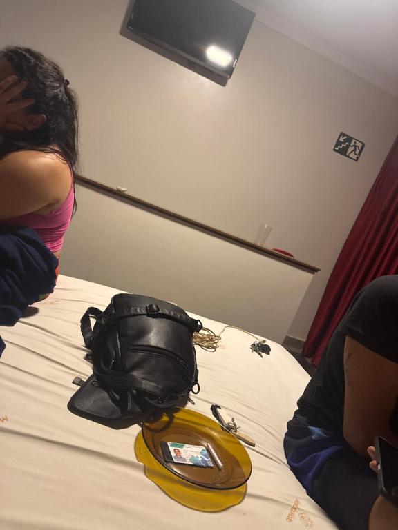 a purse sitting on top of a bed at Clt in Brasília